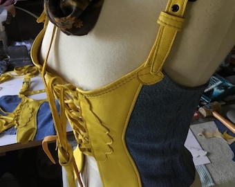 Deerskin mellow yellow Halter style bustier size small, appliqué denim on recycled denim, adjustable shoulder straps Black buckles, eyelets