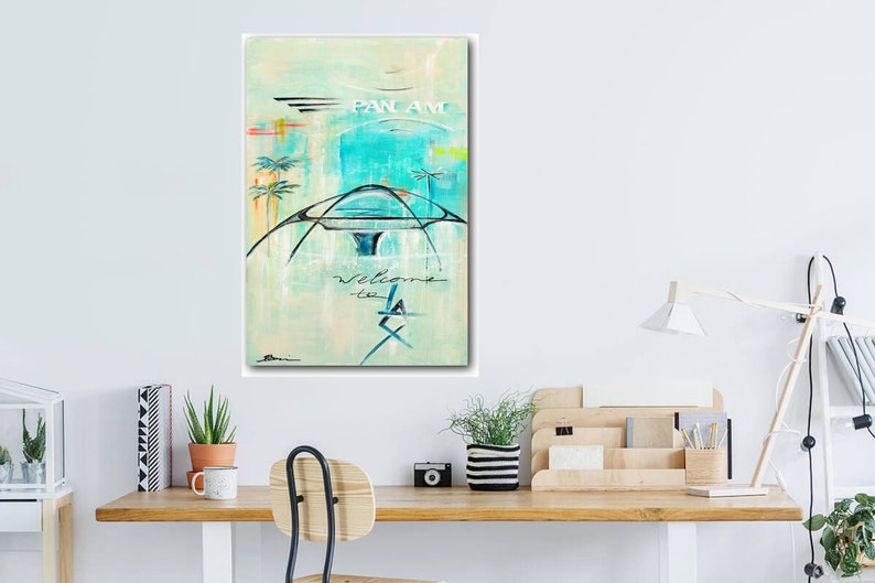May include: A vintage-style painting of a Pan Am airplane with the text "Pan Am" and "Welcome to LA" on a light blue and green background.