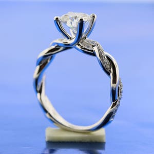Twisted Diamond Band Round 7mm Forever One Moissanite Engagement Ring, Cathedral Setting With Mil-Grain Band In 18k White Gold. image 2
