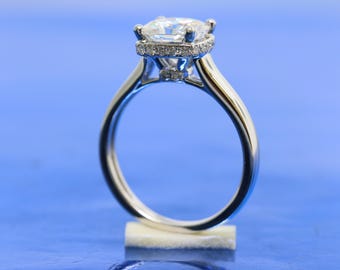 Modern Classic Charles & Colvard Four Prongs Solitaire Forever Brilliant Cushion Moissanite Diamond Engagement Ring In 18k White Gold.