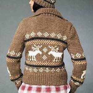 May include: Brown knitted cardigan with a white reindeer pattern and a black and white geometric pattern. The cardigan has a collar and long sleeves.
