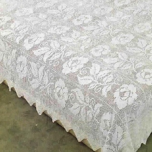 May include: A set of three ceramic mugs with a speckled, cream-colored glaze. Each mug features a different hand-painted design: a blue and green leaf, a yellow flower, and a red berry. The mugs have a simple, rounded shape.