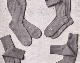 May include: Four pairs of gray socks, labeled A, B, C, and D. The socks are folded and displayed on a white background. The text "MEN'S SOCKS" is at the top of the image. The text "PATONS SUPER, OR BEEHIVE, SCOTCH FING., 3- & 4-PLY, OR PATONS SUPER CREPE, 3-PLY WEIGHT" is below the title. The text "This price only applies in Great Britain and Northern Ireland" is in the top right corner of the image. The text "3d" is in the top right corner of the image.