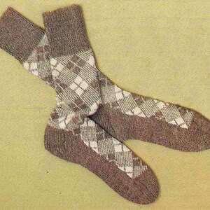 May include: A pair of brown socks with a white diamond pattern. The socks are made of a soft, knitted fabric.