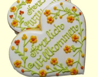 HERZLICH WILLKOMMEN Herz message 12 cm  Keks-Geschenk aus Vanille-Schokokeks oder Lebkuchen im Geschenkkarton (15*15 cm) oder in Cellophane