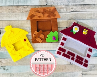 May include: Three felt house-shaped picture frames, one brown, one yellow, and one red with white brick details. The frames are on a light blue and brown wood background. The text "PDF PATTERN" is on a pink circle with white stripes. The text below the circle says "Digital file, Instant download, Instructions with pictures".