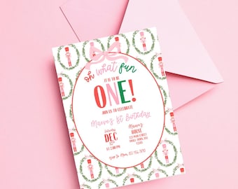 May include: A pink and green Christmas-themed first birthday party invitation with a nutcracker pattern. The invitation says "Oh what fun it is to be ONE!" and includes the date, time, and location of the party.