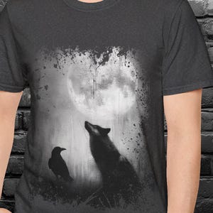 Wolf and raven under full moon moody t-shirt.
