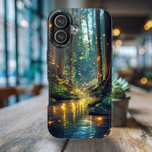May include: A phone case featuring a forest scene with a stream reflecting golden light. The case has a black border and a dual-lens camera cutout. The forest has tall trees and a stream with glowing lights.