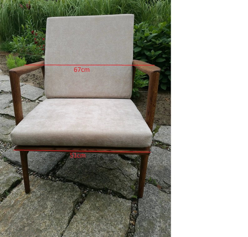 A concrete grey Scandinavian lounge chair, oak frame, cushioned, low-slung, Mad Men vibe, Jarl, vintage Ikea, an icon form image 8