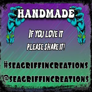 May include: A handmade graphic with a purple and green gradient background. The word "HANDMADE" is at the top, with zombie hands on each side. Text reads "IF YOU LOVE IT PLEASE SHARE IT!" and social media handles.