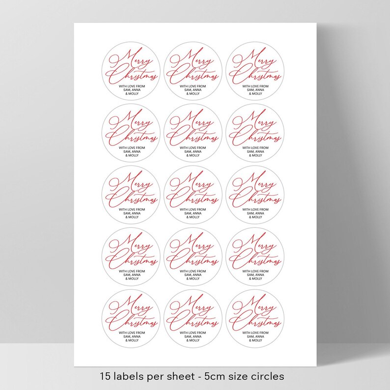 May include: A sheet of 15 white round gift tags with red cursive text that reads "Merry Christmas" with the words "With love from Sam Anna & Molly" printed below. The tags are 5 cm in diameter.