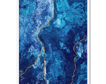 May include: Abstract art print featuring a blue and gold marble design. The print has a white border.