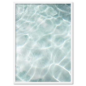 May include: A close-up of rippling water, with light reflecting off the surface, creating a shimmering effect. The water is a light blue-green colour.