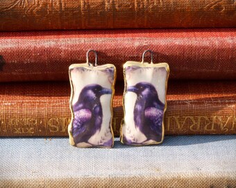 Handmade ceramic charms: Raven illustration with a 24kt gold lustre edge