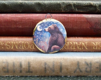 Handmade ceramic pendant with a bear illustration and a 24k gold lustre edge