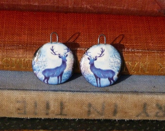 Handmade ceramic charms with an illustration of a deer / stag