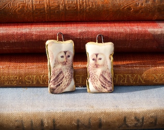 Handmade ceramic charms: illustration of an owl with a 24kt gold lustre edge.