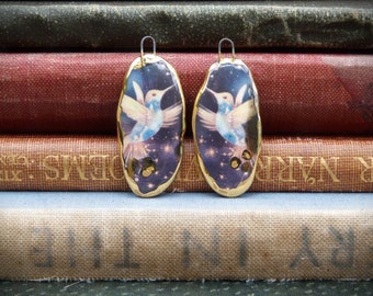 Handmade ceramic hummingbird illustration charms with a 24kt gold lustre edge