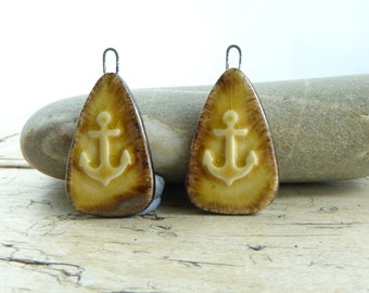 Handmade ceramic anchor charms in honey and bronze