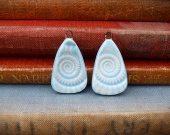 Pair of handmade ceramic fossil charms