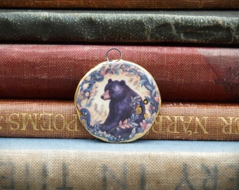 Handmade ceramic pendant with a bear illustration and a 24k gold lustre edge