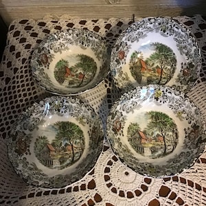 May include: A set of three ceramic mugs with a speckled, matte finish. The mugs are in shades of cream, light grey, and dark grey. Each mug has a simple, minimalist design, ideal for coffee or tea.