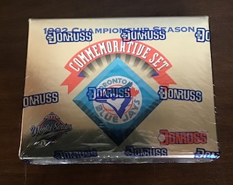 May include: A sealed commemorative set box with a gold background. The box features the text "1992 Championship Season" and "Commemorative Set" with the Toronto Blue Jays logo. The brand name "Donruss" is also visible.