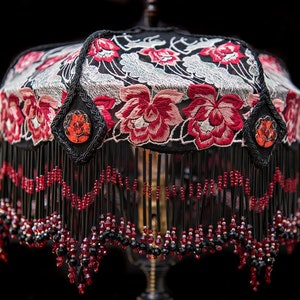 Ayla Rose in lace with distinctive hand beaded fringe on an antique, one of a kind, lamp stand.