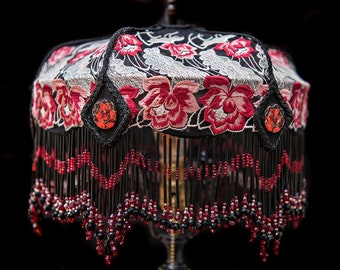 Ayla Rose in lace with distinctive hand beaded fringe on an antique, one of a kind, lamp stand.