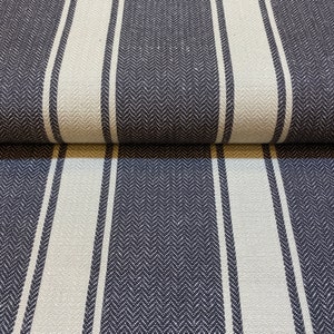 May include: Navy blue and white striped fabric with a herringbone pattern. The fabric is folded in half, showing the pattern on both sides.