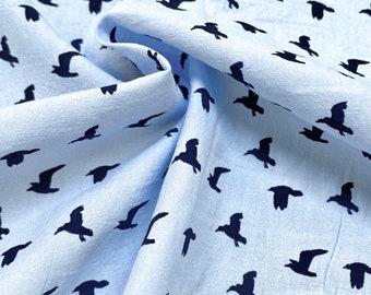 May include: Light blue fabric with a repeating pattern of dark blue bird silhouettes.