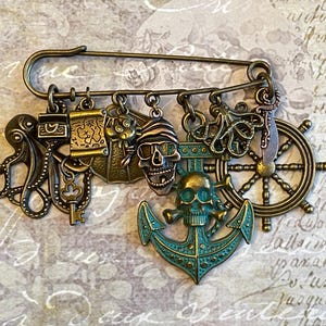 Pirate Kilt Safety Pin Jewelry with 11 Charms: Octopus, Treasure Chest, Key, Map, Shell, Crab, Pirate Skull, Anchor, Helm, Sword - Cosplay