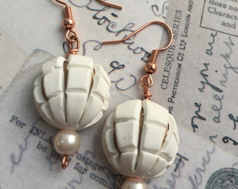 Conchita dangle earrings in white