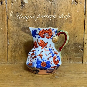 An awesome antique Masons hydra jug