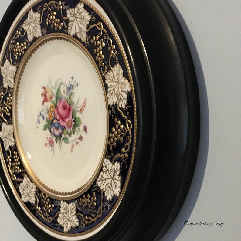 plate frame A very desirable royal crown derby vine cobalt 27cm plate in antique wooden