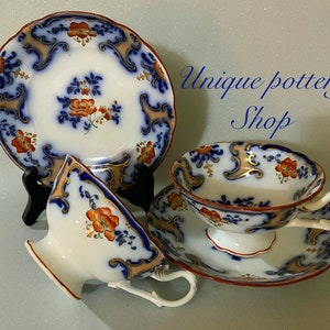 A stunning English antique pair of tea cups