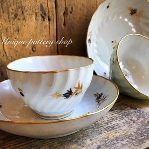 A stunning pair of English antique tea bowls by Worcester- Grainger