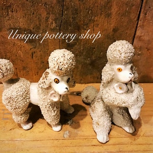 A stunning 20th c  pair of Chinese standard poodle figureens