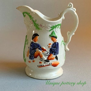 A beautiful 19th c English Staffordshire, creamware jug