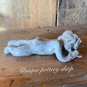 A stunning and unique, 20th c English antique, “the sleeping boy”