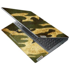 May include: A Lenovo laptop with a camouflage pattern in shades of green and tan. The laptop is open, displaying the keyboard, touchpad, and screen. The Lenovo logo is visible on the bottom and top of the laptop.