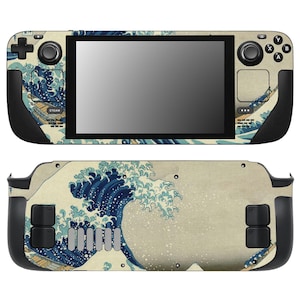 May include: A handheld gaming console skin featuring a Japanese wave design in shades of blue, beige, and white. The skin covers the front and back of the console, with cutouts for buttons, joysticks, and the screen. The design is a stylized depiction of a wave.