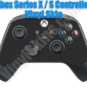 May include: Black Xbox Series X/S controller with a carbon fiber vinyl skin. The controller has the standard Xbox buttons: A, B, X, Y, and a D-pad.