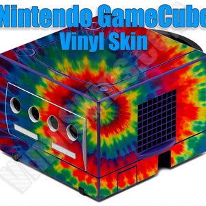 May include: A Nintendo GameCube console with a vibrant tie-dye vinyl skin. The skin features a swirling pattern of red, yellow, blue, and purple. The text "Nintendo GameCube Vinyl Skin" is displayed in blue. The console has a white front panel with circular vents.