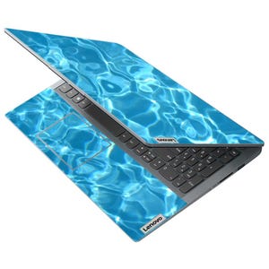 May include: A Lenovo laptop with a vibrant blue water ripple design. The laptop is open, displaying the keyboard and touchpad. The Lenovo logo is visible on the bottom and top of the laptop.