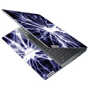 May include: A Lenovo laptop with a striking design featuring a blue and white lightning bolt pattern across the lid and keyboard area. The laptop is open, displaying the keyboard and touchpad.