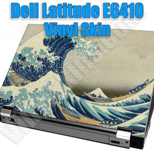 May include: A laptop computer with a vinyl skin featuring a Japanese wave design. The design is a reproduction of the famous "Great Wave off Kanagawa" woodblock print by Hokusai. The laptop is closed and the skin covers the entire top and back of the device. The text "Dell Latitude E6410 Vinyl Skin" is displayed above the image.