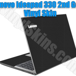 May include: A black laptop with a carbon fiber vinyl skin. The laptop has the Lenovo logo on the back.