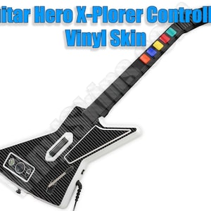 May include: Guitar Hero X-Plorer Controller Vinyl Skin with a black and white carbon fiber design. The skin covers the entire controller, including the buttons and the neck.